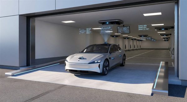 Autonomous vehicle entering a parking facility with technology indicators